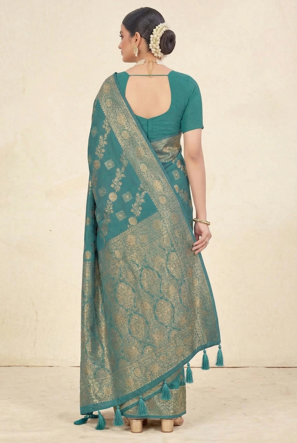 beautifully adorned with intricate zari weaving banarasi saree. The saree features delicate floral motifs woven across the body, complemente