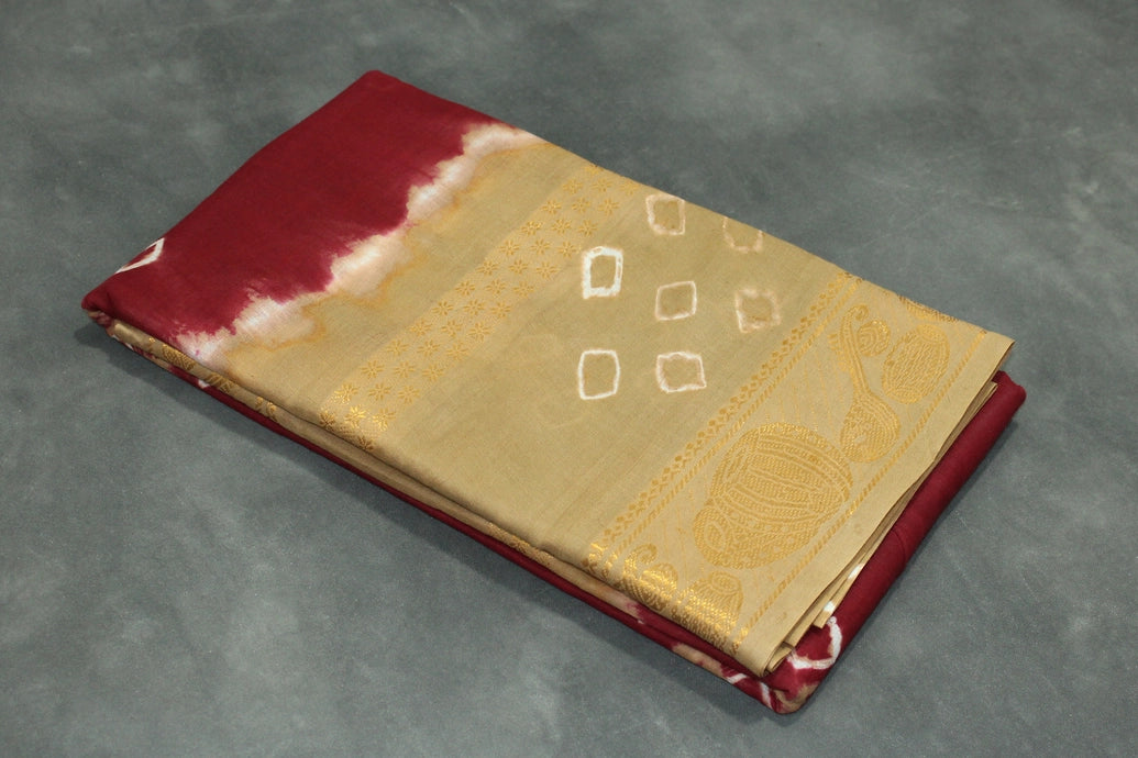 Maroon Sungudi Cotton Bandhani Saree with Golden Zari Border and Traditional Instrument Motifs, Unstitched Blouse Included Saree JCS Fashions