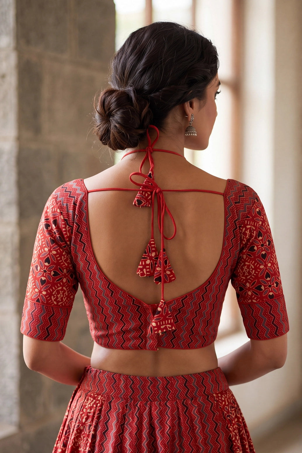 Red Ajrakh Print Cotton Padded Blouse with Geometric Floral Motifs & Zigzag Border, Elbow Sleeves, Back Knot