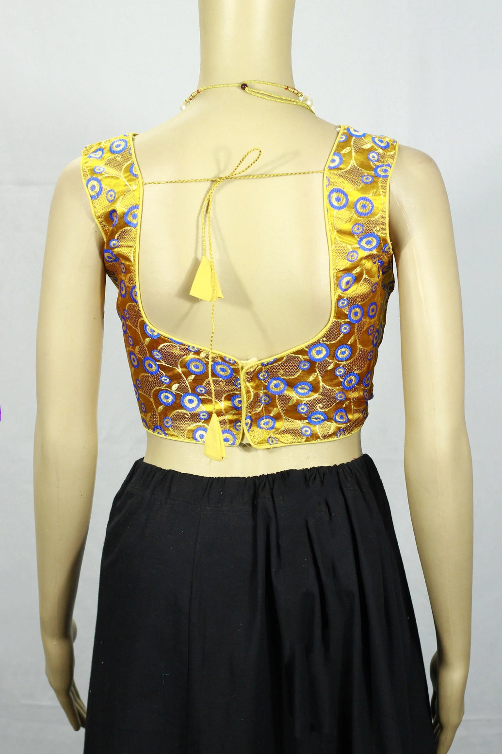 Yellow Designer Padded Blouse with Zari Finish, Circular Motifs, Sleeveless Back Knot, Readymade for Women