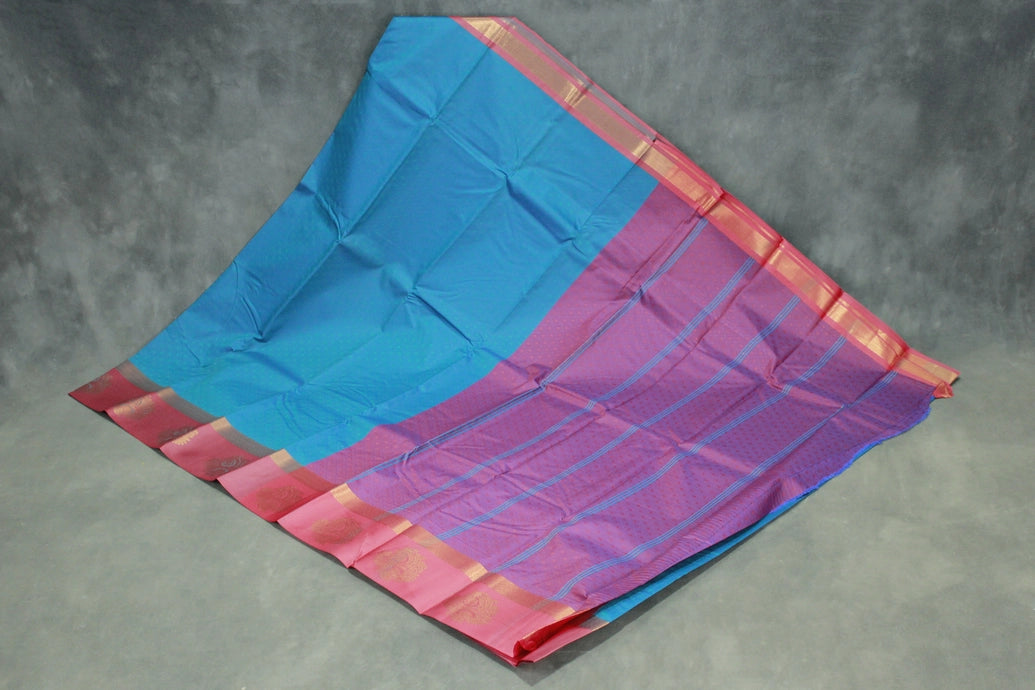 Peacock Blue Emboss Satin Border Semi Silk Saree with Floral Design and Blouse Piece