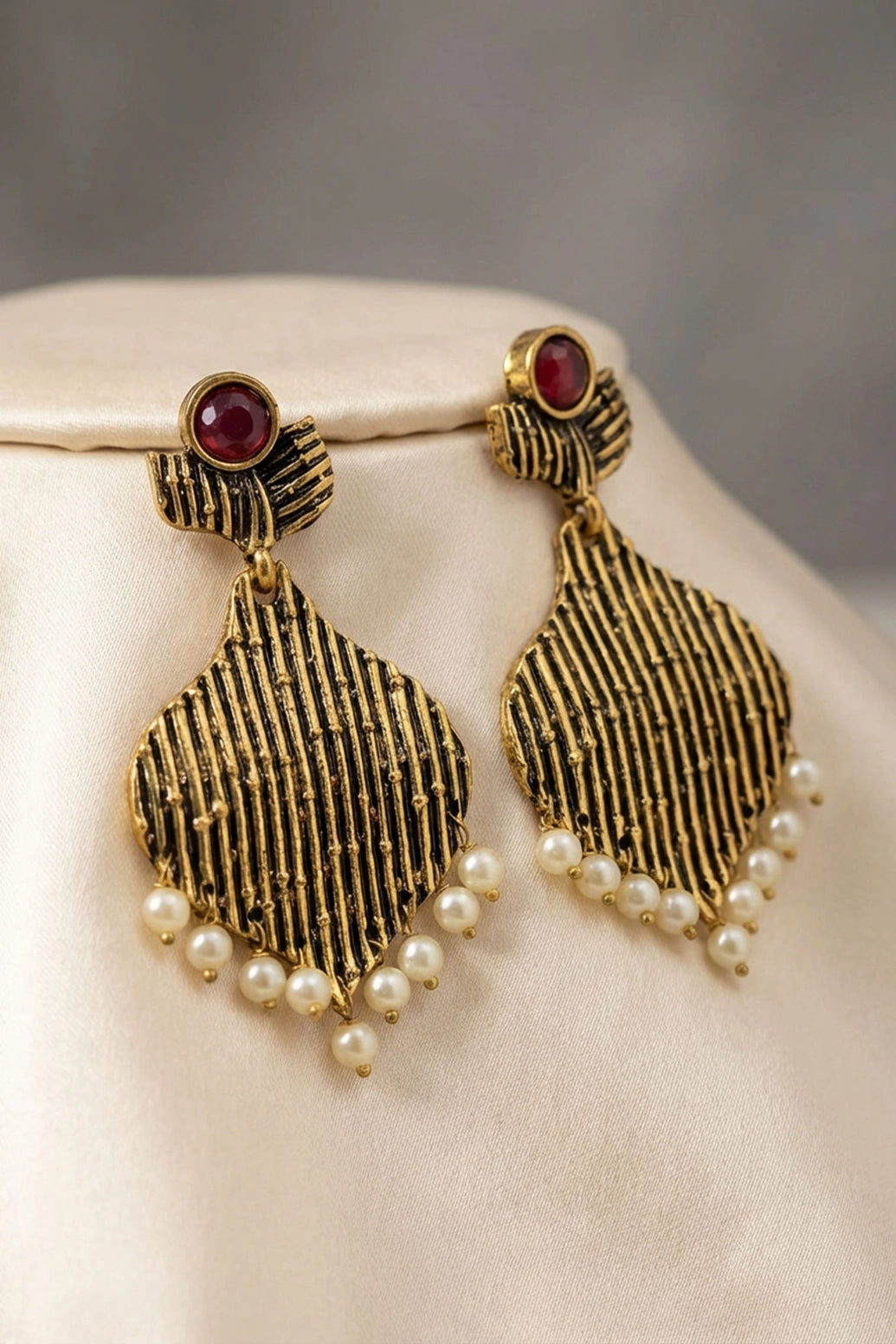 Maroon Stone Gold-Tone Jhumka Earrings with Pearl Beads for Traditional Festive Wear