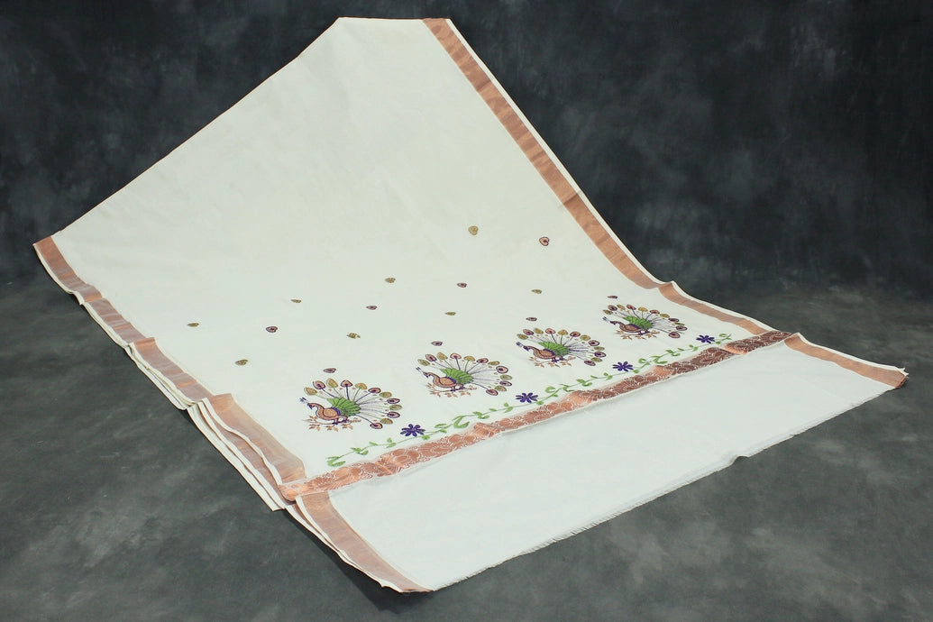 Fabric: Pure Kerala Cotton – lightweight, breathable,
• Design: Rich machine embroidery in Copper zari and thread with detai