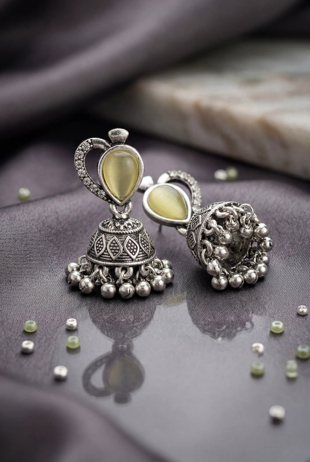 Lemon Yellow Oval Stone Oxidized Silver-Tone Jhumka Earrings with Floral Cutwork and Ghungroo Danglers