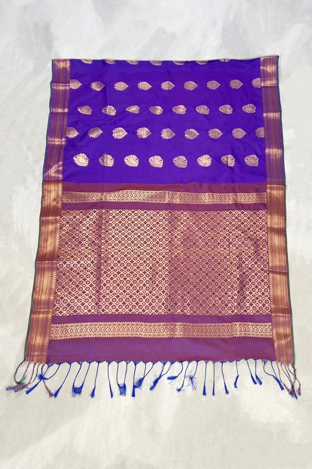 Purple Semi Soft Silk Saree with Contrast Border, Delicate Gold Zari Buttas and Traditional Floral Zari Border