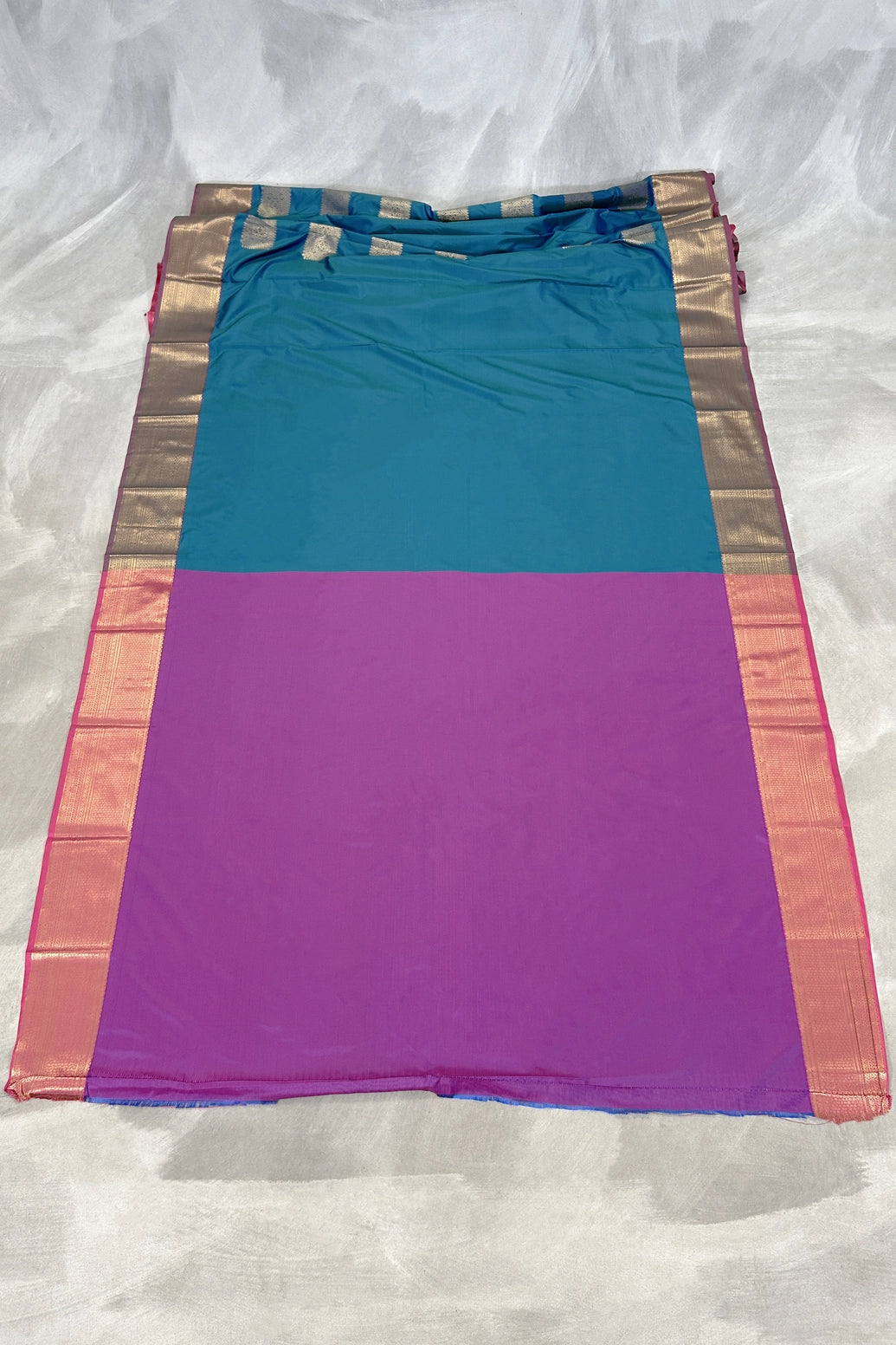 Peacock Blue Soft Silk Saree with Gold Zari Buttas and Traditional Floral Border