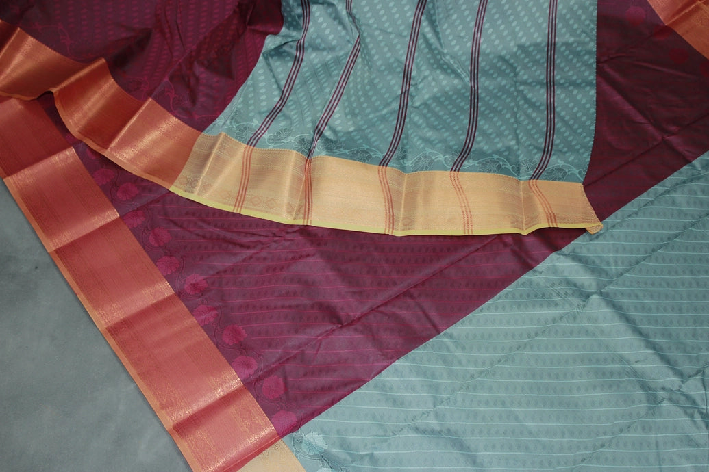 Maroon Emboss Silk Saree with Contrast Zari-Style Border and Semi Silk Design