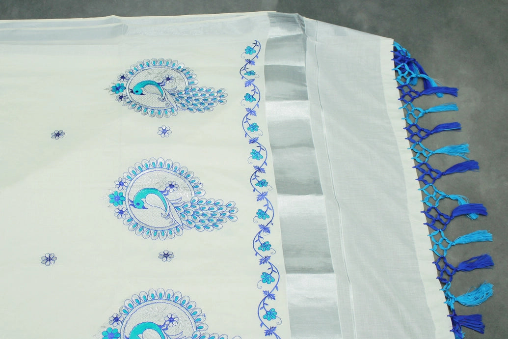 Half White Kerala Cotton Saree with Peacock Embroidery and Silver Zari Thread Work