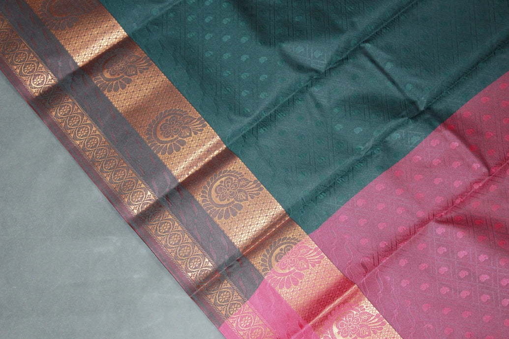 Dark Green Emboss Silk Saree with Traditional Border Design