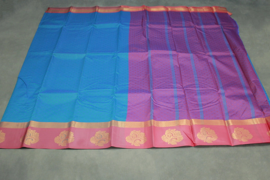 Peacock Blue Emboss Satin Border Semi Silk Saree with Floral Design and Blouse Piece