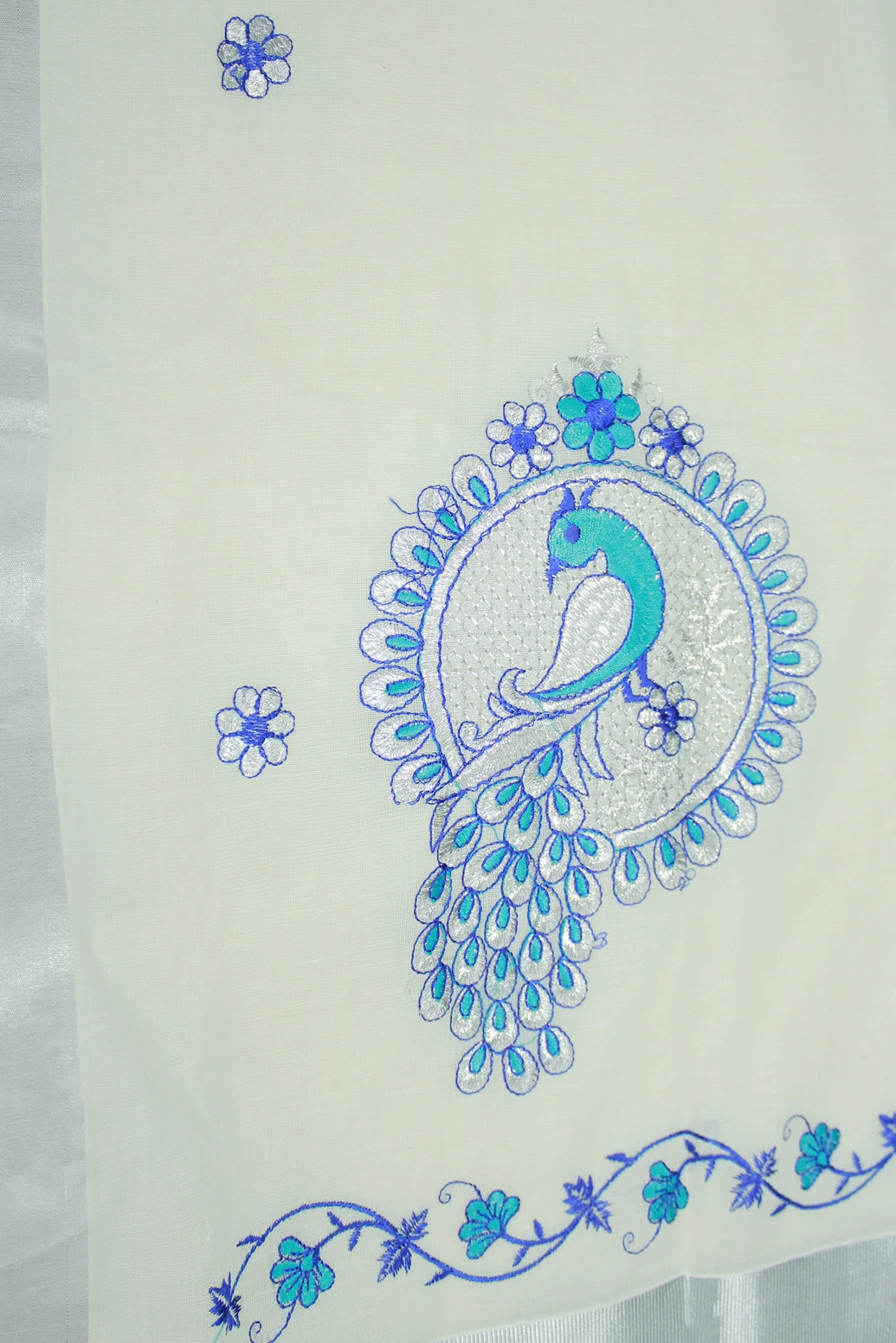 Half White Kerala Cotton Saree with Peacock Embroidery and Silver Zari Thread Work
