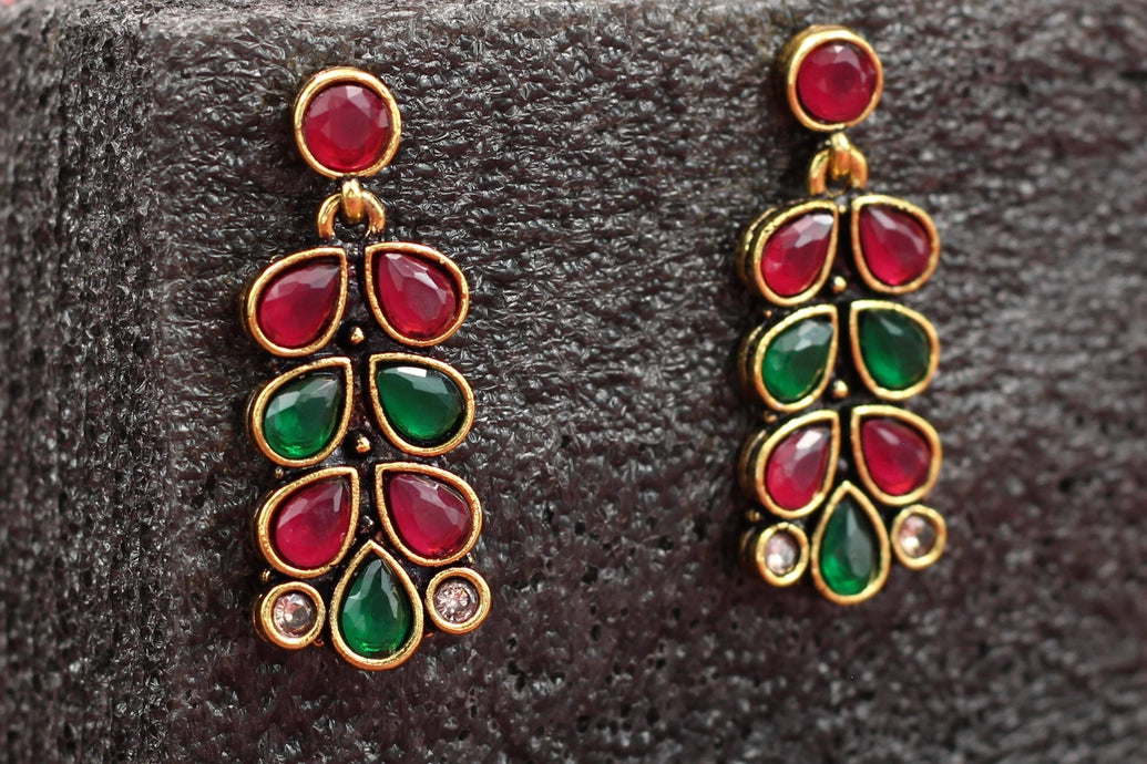 Maroon & Red Gold-Tone Teardrop Leaf Earrings with Antique Finish for Festive Wear Jewelry JCS Fashions