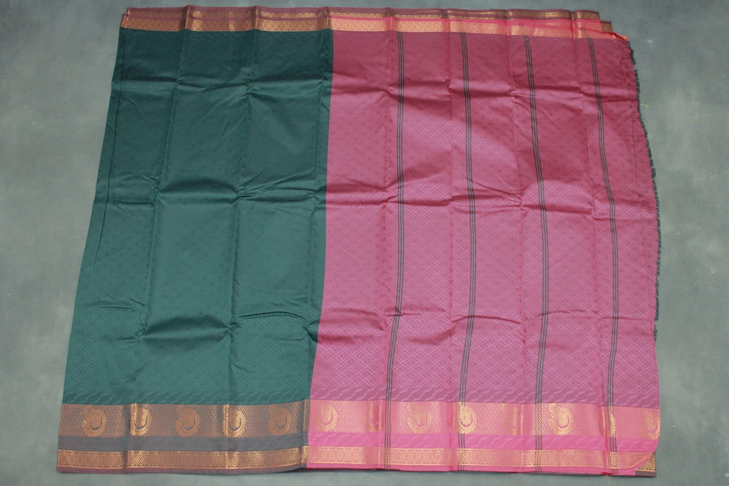 Dark Green Emboss Silk Saree with Traditional Border Design
