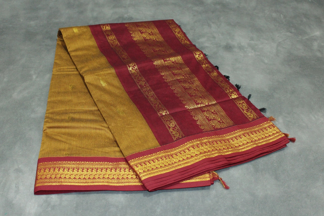 Silk cotton sarees with grand pallu and thick Zari border both sides. Full body small butties. With blouse Saree JCS Fashions