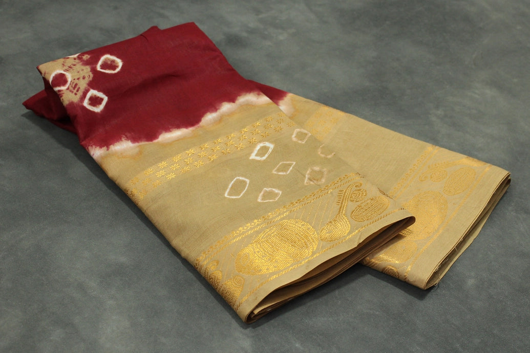 Maroon Sungudi Cotton Bandhani Saree with Golden Zari Border and Traditional Instrument Motifs, Unstitched Blouse Included Saree JCS Fashions