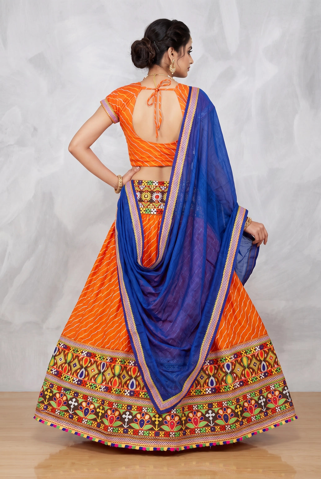 Orange Navratri Chaniya Choli with Lehriya Print and Kutchi Mirror Border Set for Festive Party Wear