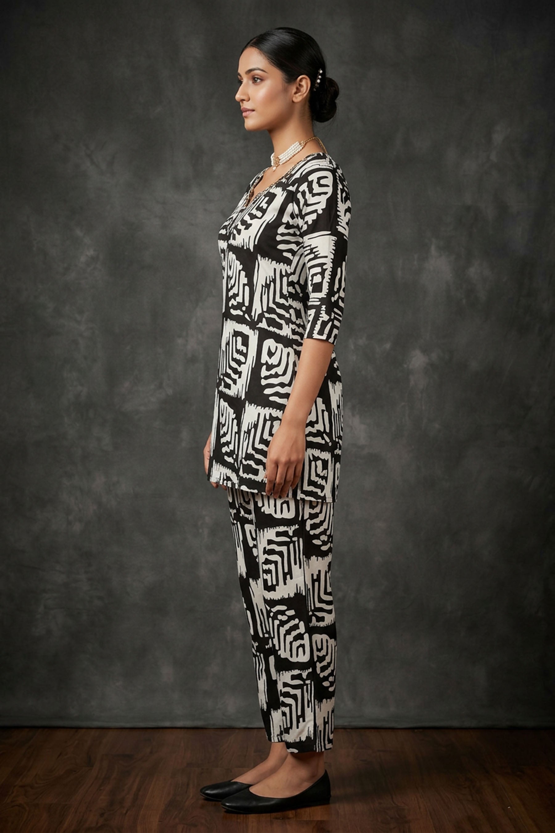 Black & White Rayon Printed Kurti Set with Beaded Neck and Elastic Pant — side pose