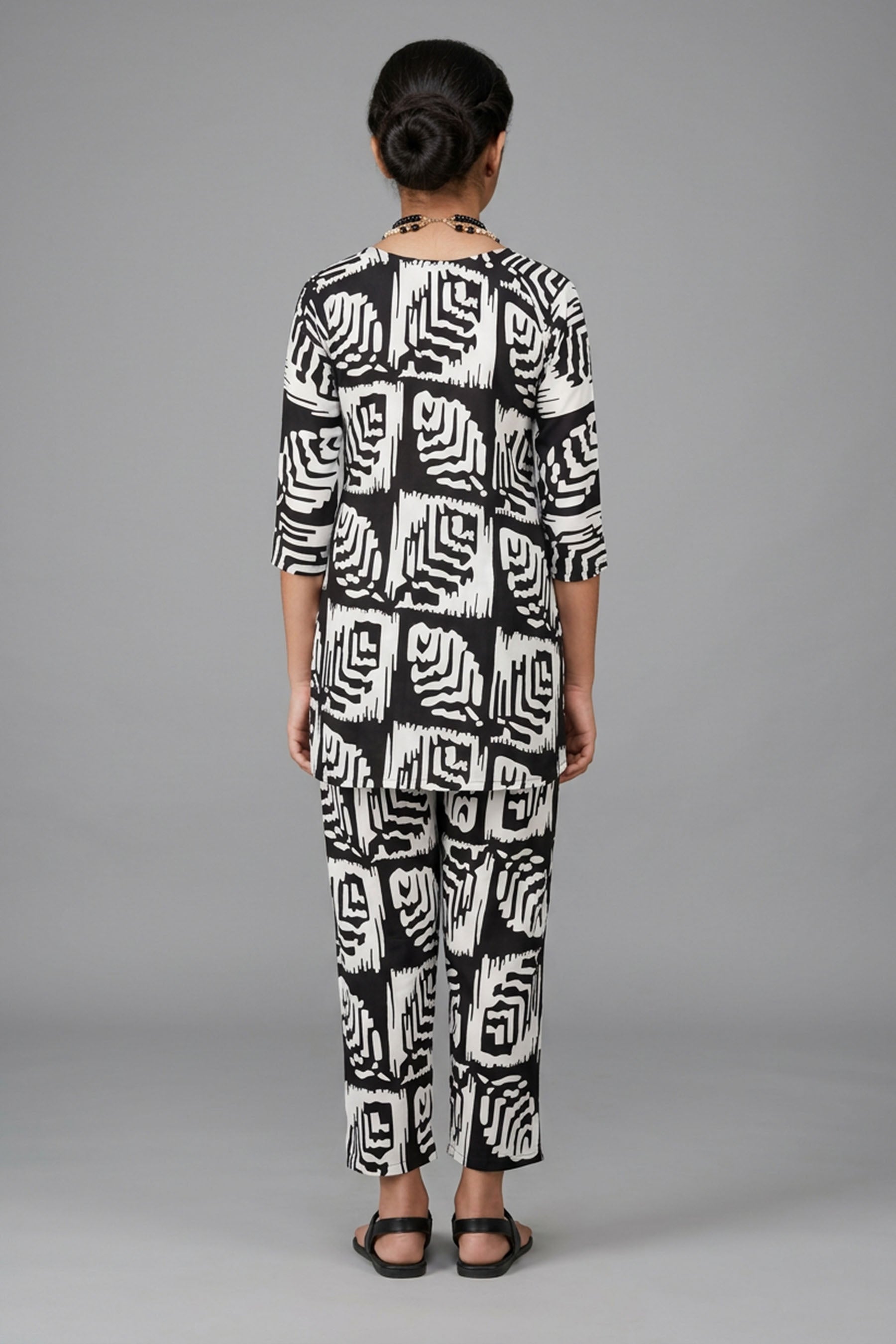 Black & White Rayon Printed Kurti Set with Beaded Neck and Elastic Pant — back pose