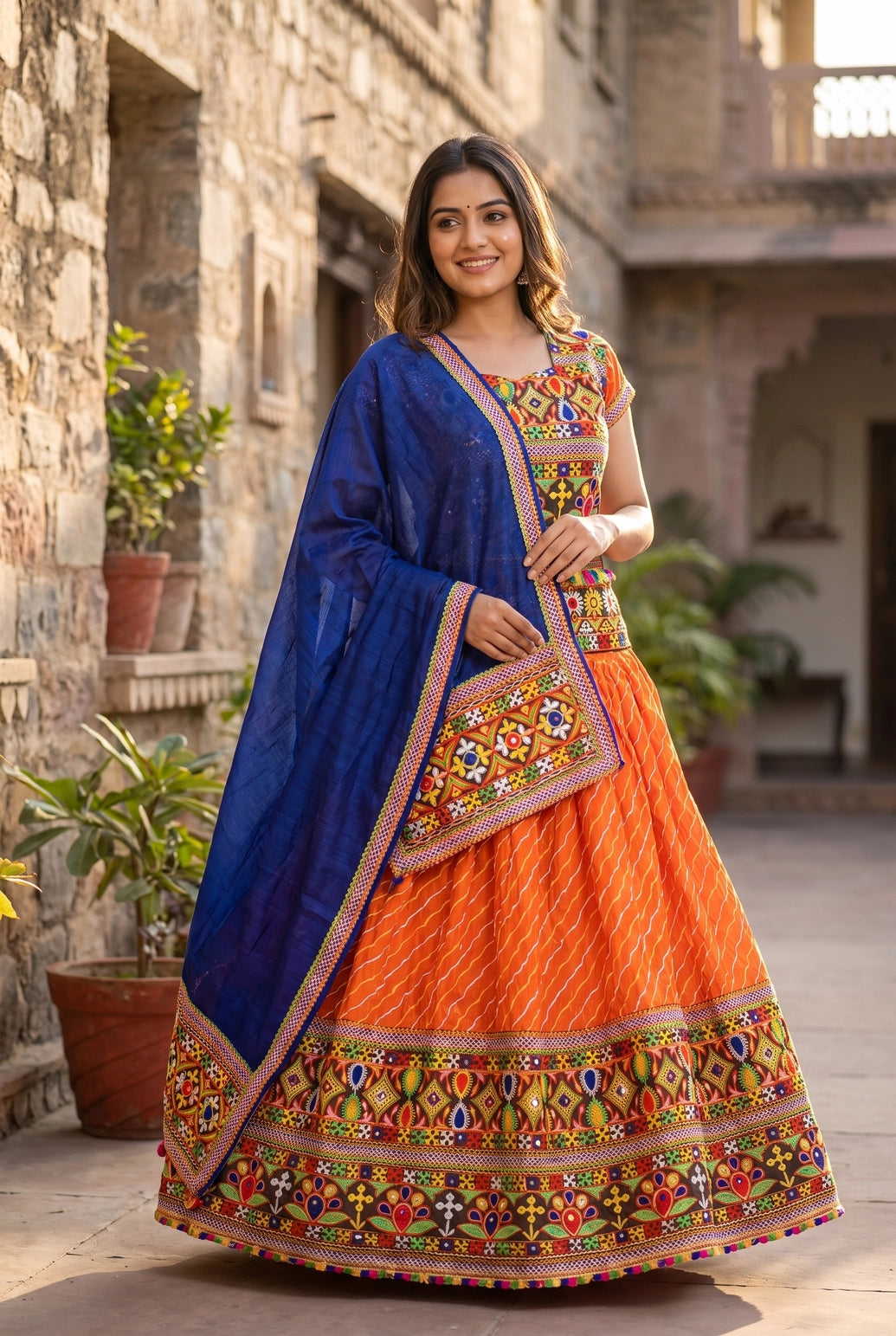 Orange Navratri Chaniya Choli with Lehriya Print and Kutchi Mirror Border Set for Festive Party Wear - Orange