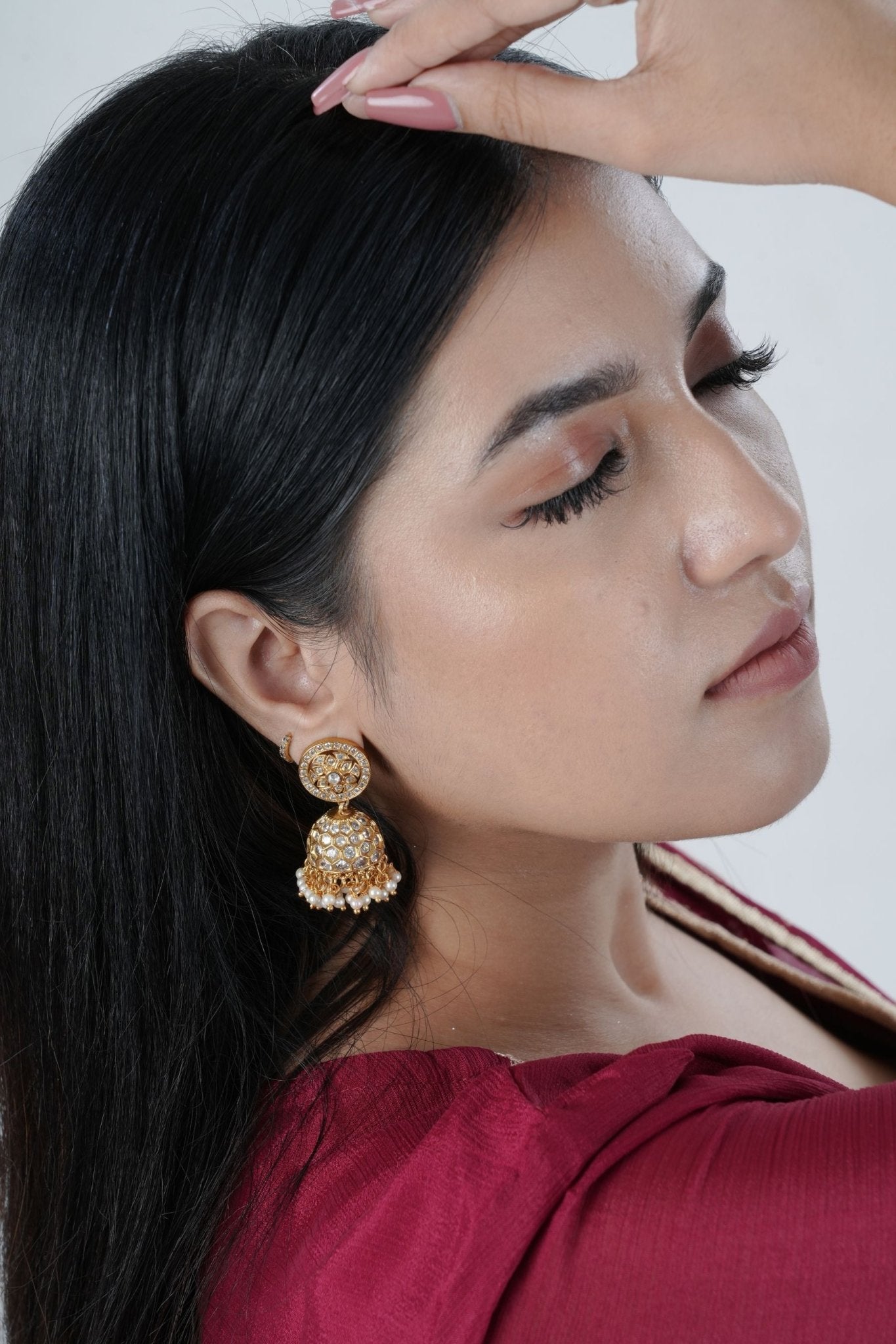 JCS Fashions' Gleaming Gold Jhumka Earrings with White Stones & Pearls Jewelry JCS Fashions