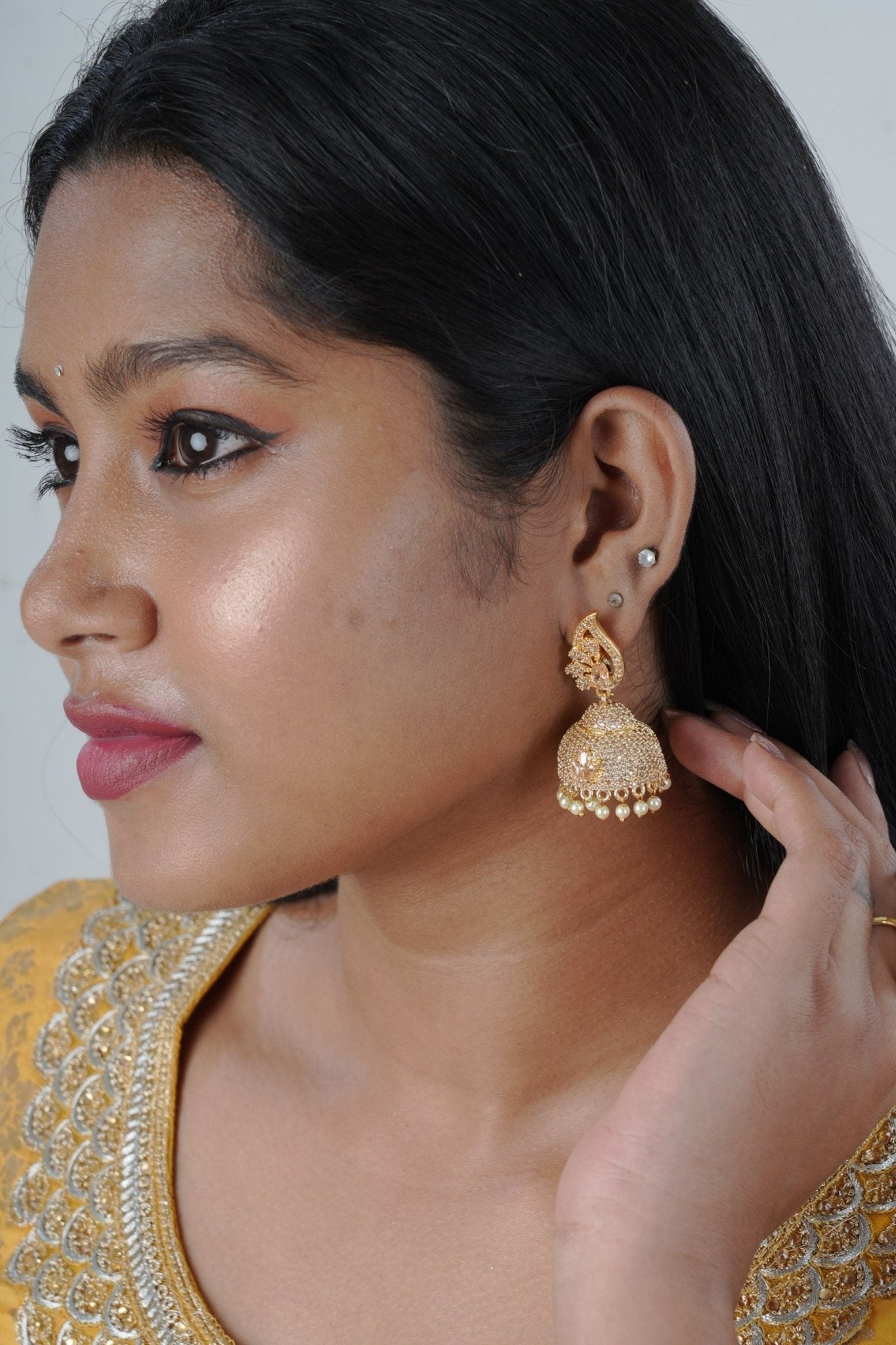 Radiant Gold Polish Jhumka Earrings with Elegant White Stones and Pearls Jewelry JCS Fashions