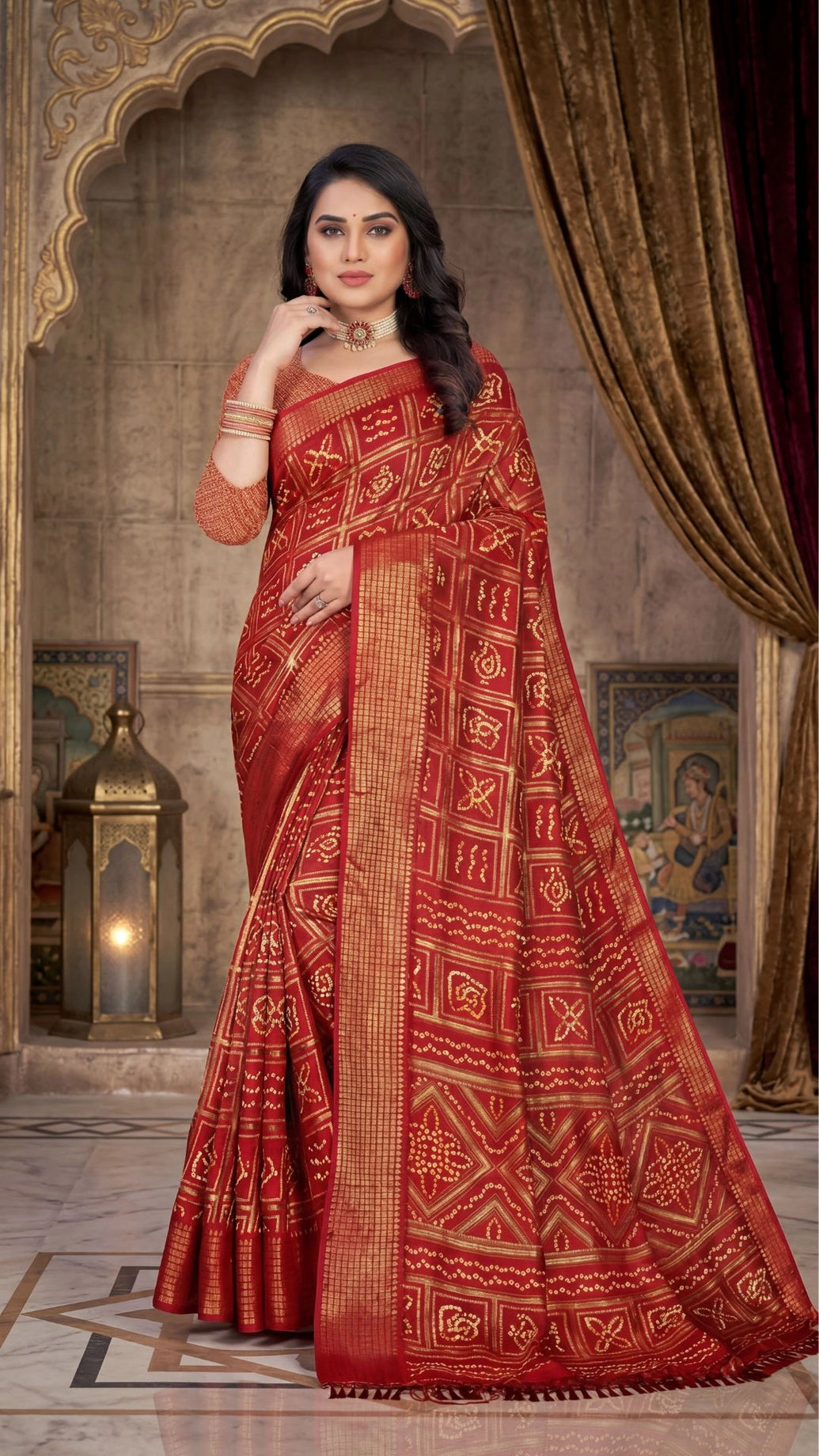 Deep Red Bandhani Chiffon Saree with Gold Zari Motifs and Broad Border for Festive Wear