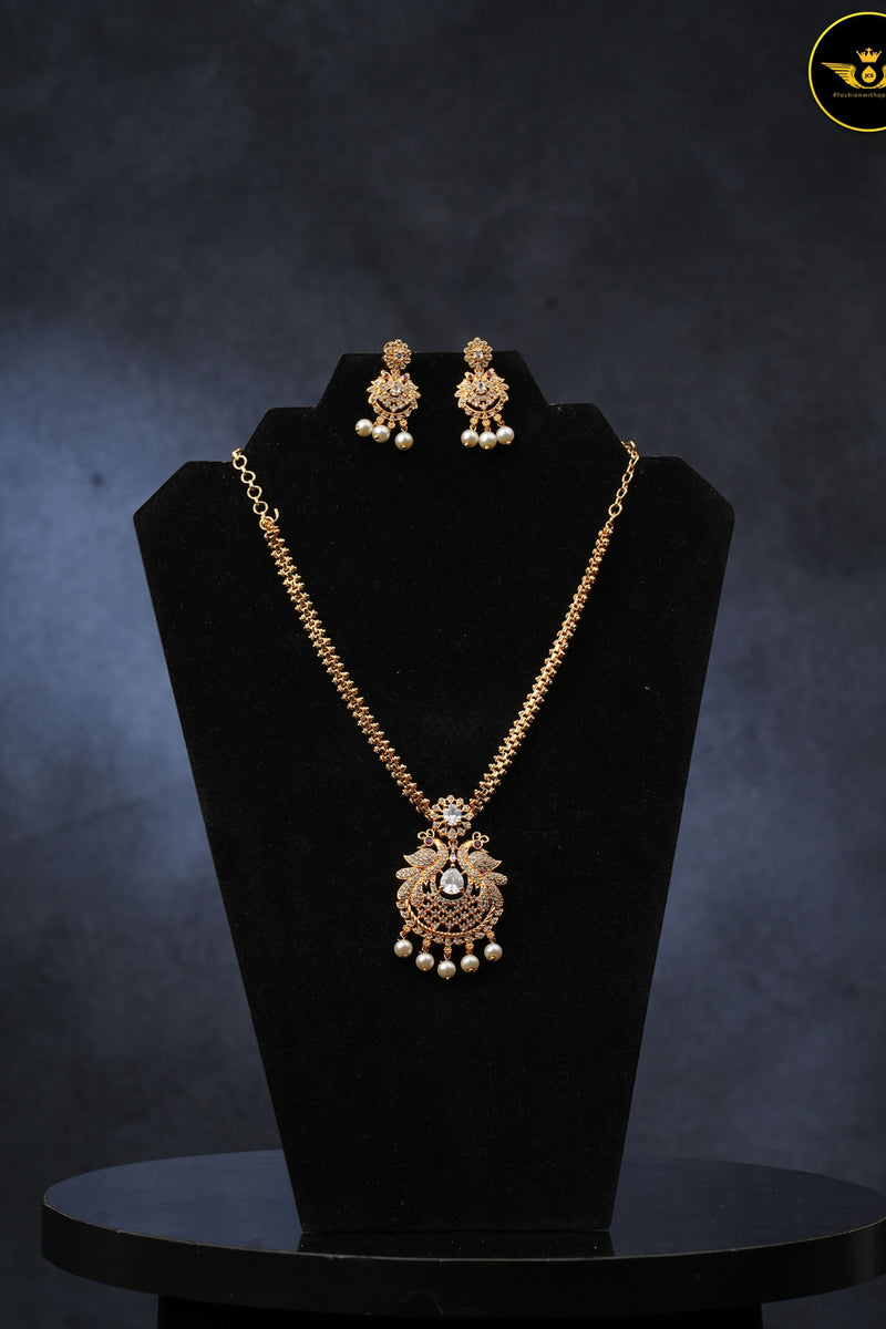 Radiant Peacock Gold-Plated Neckset with Earrings | Sparkling White Stones