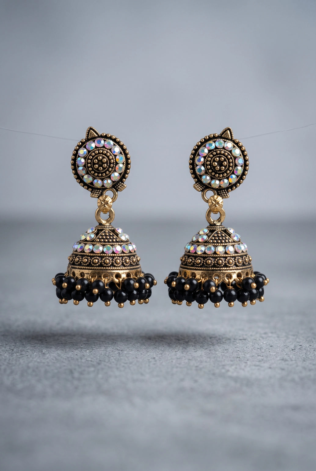Traditional Jhumka Earrings with White Stone Work and Beaded Gold-Tone Drops for Festive Wear - Black