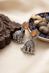 Oxidized Silver-Tone Oval Stone Jhumka Earrings with Floral Cutwork & Ghunghroo Beads - Brown