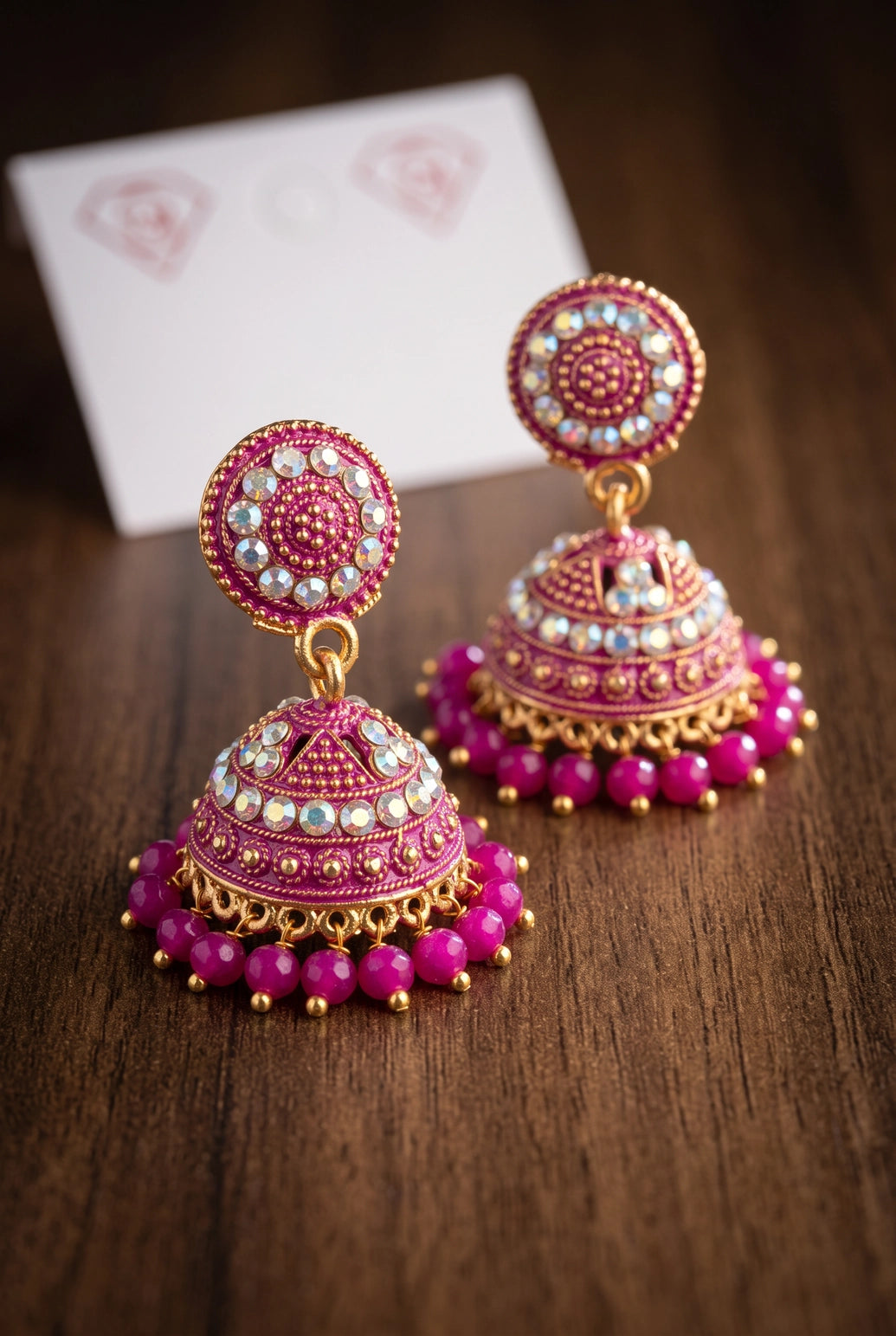 Traditional Jhumka Earrings with White Stone Work and Beaded Gold-Tone Drops for Festive Wear - Pink