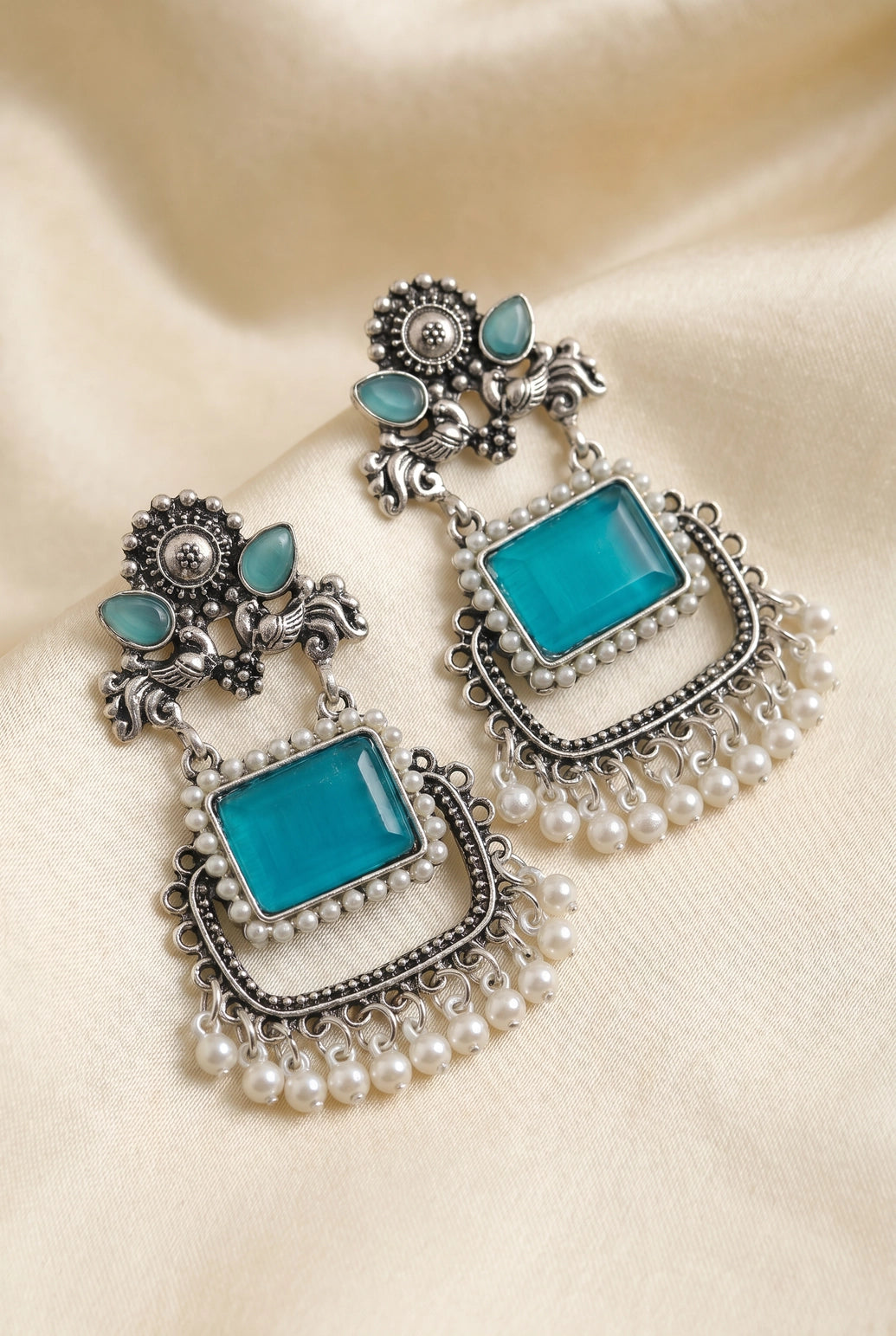 Sea Blue Oxidized Silver-Tone Teardrop Drop Earrings with Floral Motifs, Pearl Beads and Dangler Stone