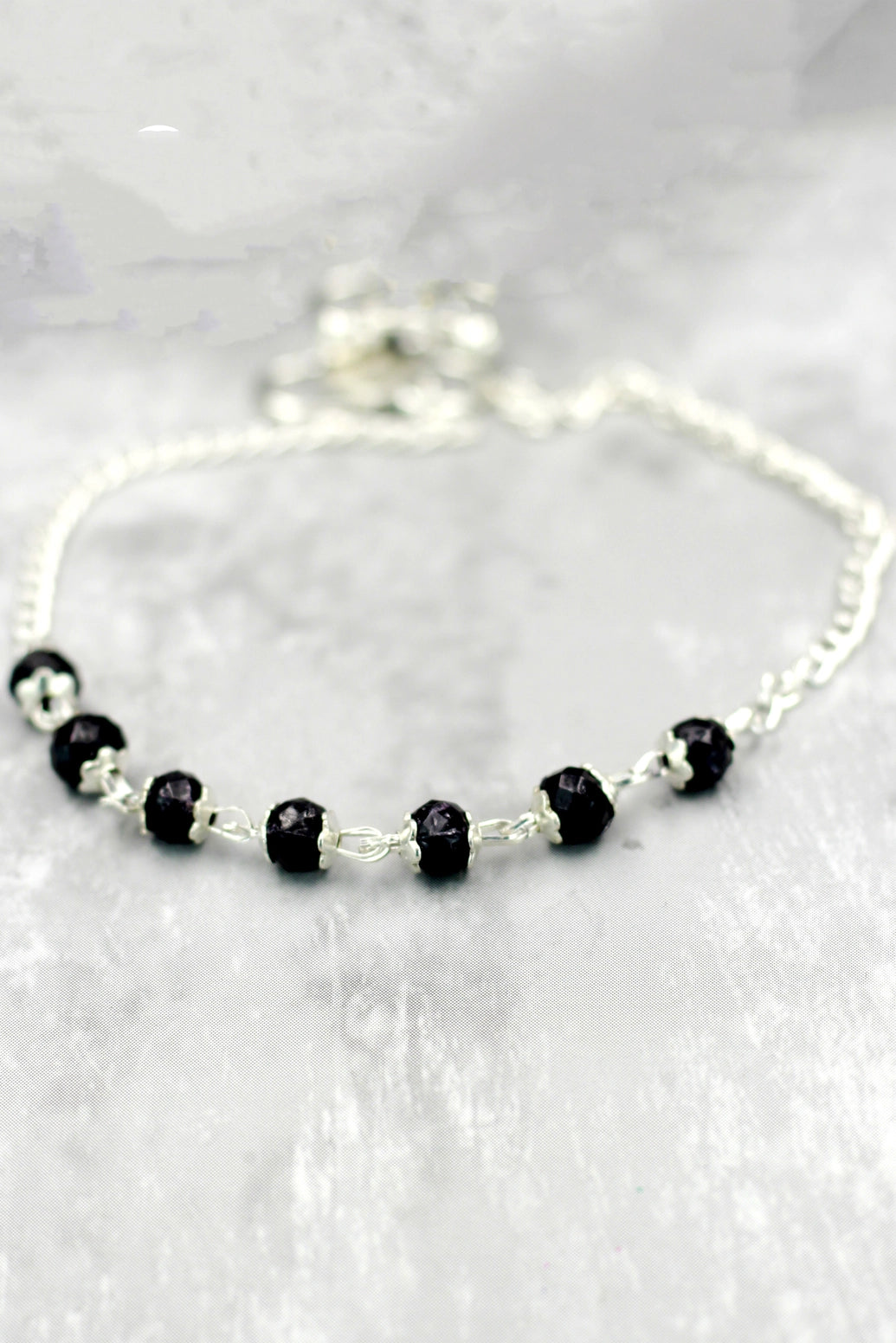 Silver-Plated Traditional Anklet with Black Beads and Flower Charm for Daily Wear and Festive Outfits