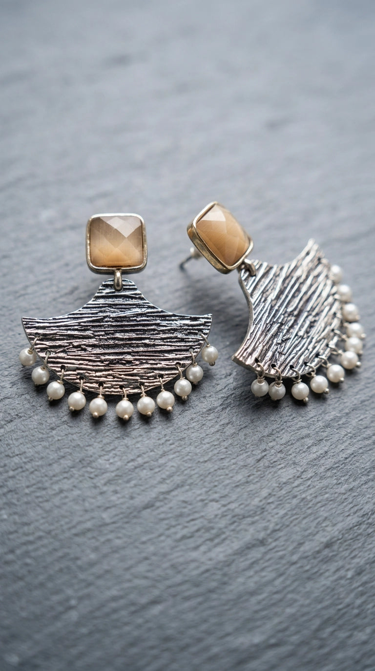 Cream Stone Silver-Tone Textured Teardrop Dangle Earrings with Pearl Drops for Festive Party Wear