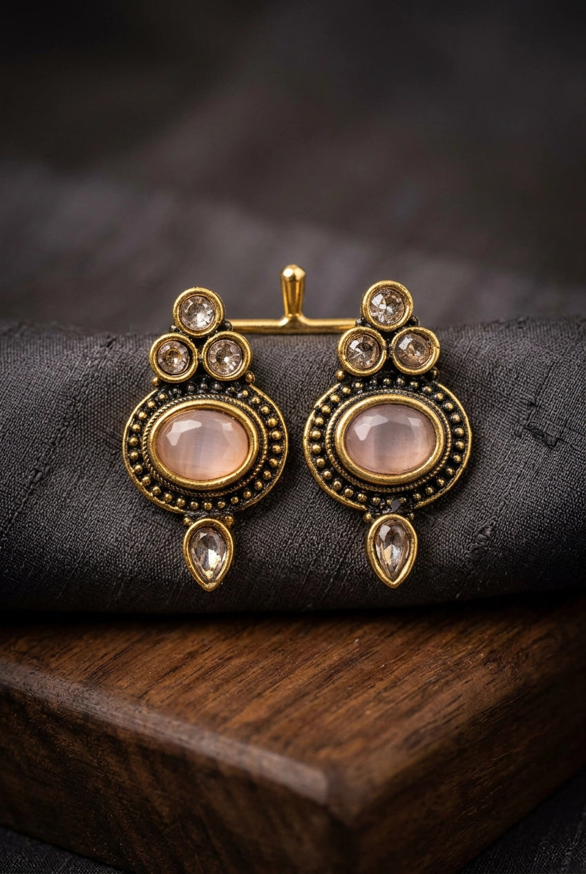 Light Pink Oval Stud Earrings with Antique Gold-Tone Detail and Tiny Bead Accents for Traditional Wear