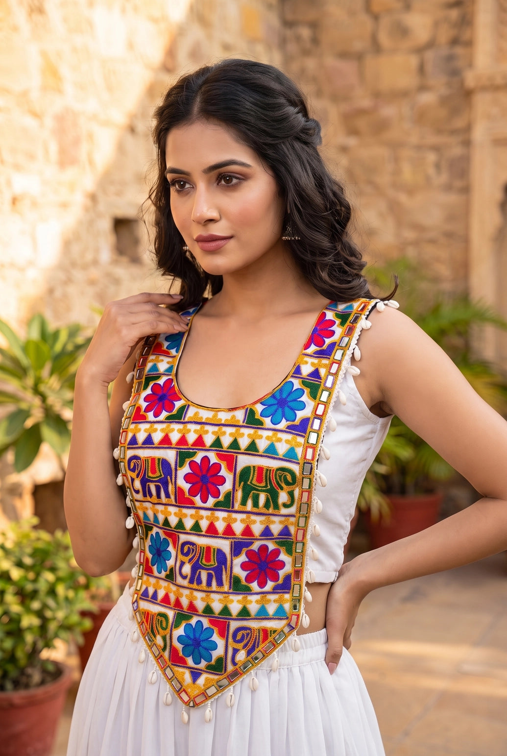 Kutchi Mirror-Work Navratri Blouse with Elephant Motif and Cowrie Border, Sleeveless Ethnic Wear for Women