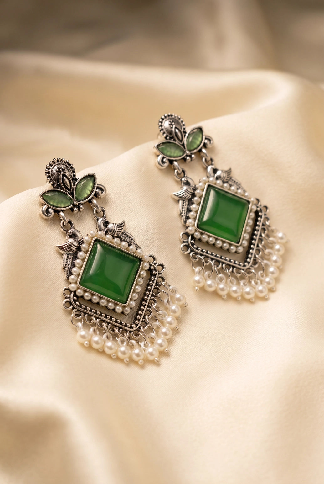 Green Oxidized Silver-Tone Teardrop Drop Earrings with Pearl & Floral Motifs for Traditional Wear