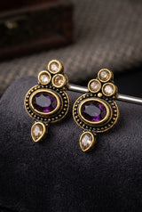 Purple Oval Stone Antique Finish Stud Earrings with Gold-Tone Detailing for Traditional & Festive Wear