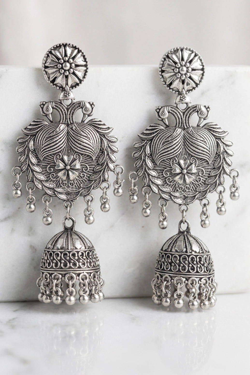 Oxidized Black Silver Jhumka Earrings with Floral Leaf Engraving and Dangling Beads for Traditional Wear