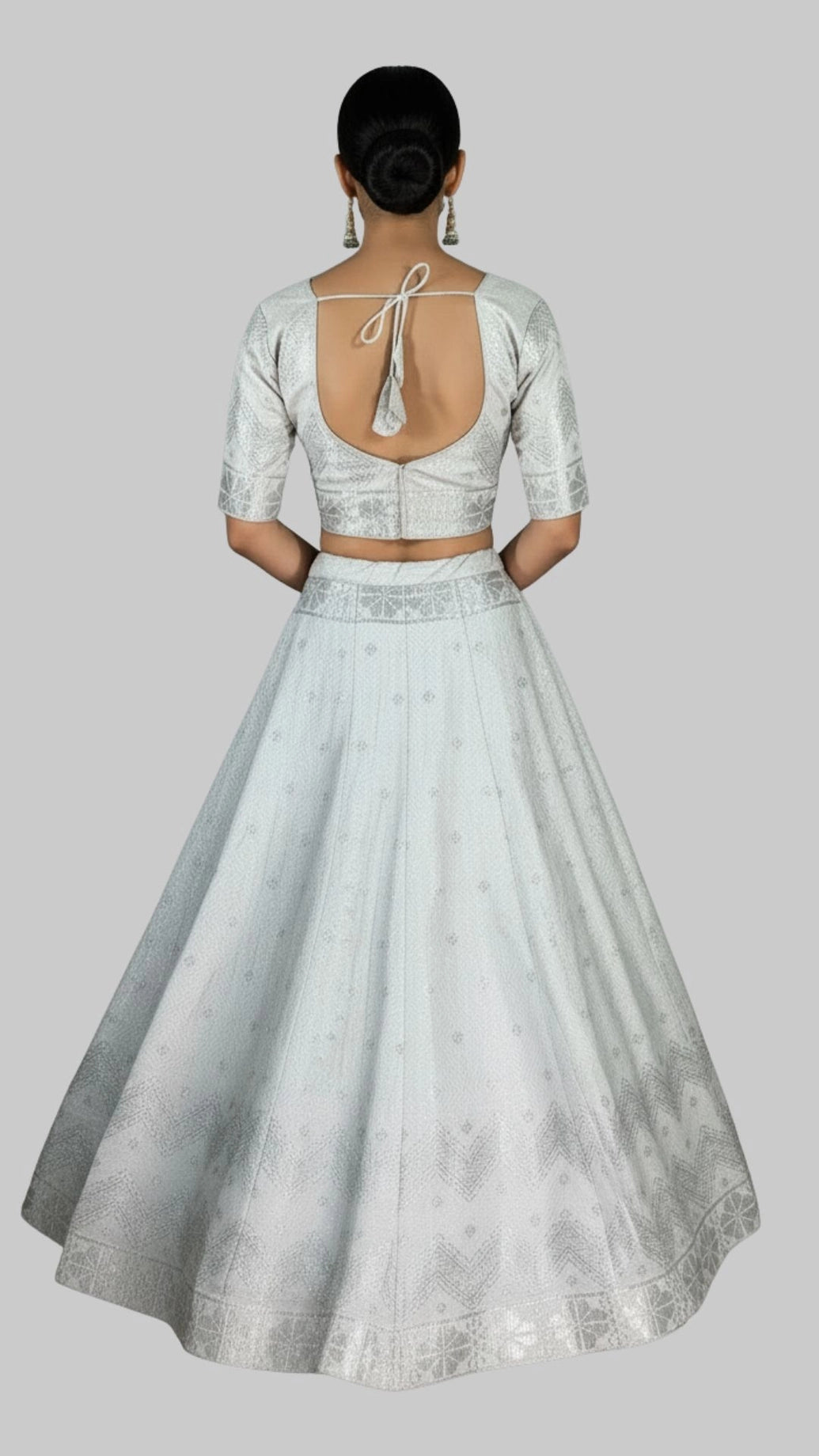 White Jacquard Silk Lehenga with Matching Elbow Sleeve Blouse and Zari Motifs