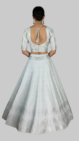 White Jacquard Silk Lehenga with Matching Elbow Sleeve Blouse and Zari Motifs