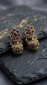 Purple Floral Jhumka Earrings in Antique Gold Finish with Crystal Stud Pattern for Traditional Festive Wear