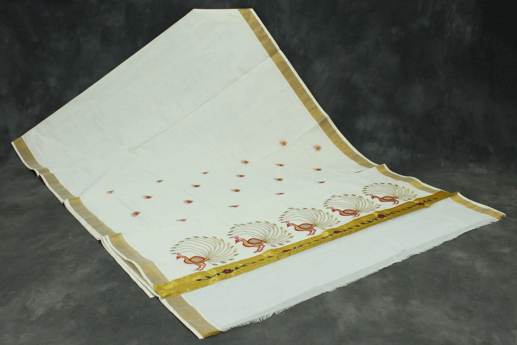 Fabric: Pure Kerala Cotton – lightweight, breathable, 
        •        Design: Rich machine embroidery in Gold zari and thread with detaile