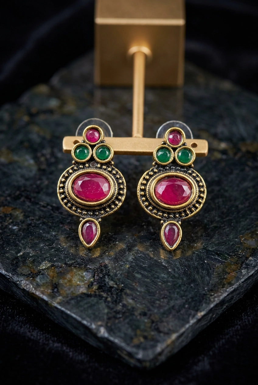 Antique Finish Stud Earrings with Oval Red Stone, Green Accents & Gold-Tone Detailing for Traditional Wear