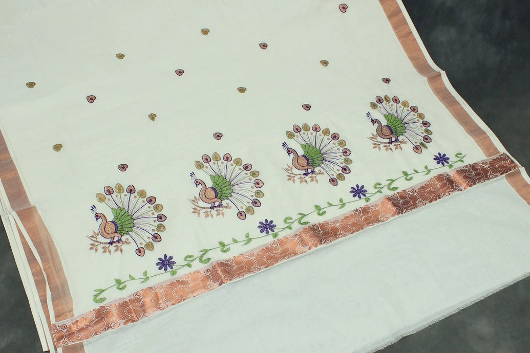 Fabric: Pure Kerala Cotton – lightweight, breathable, 
        •        Design: Rich machine embroidery in Copper zari and thread with detai
