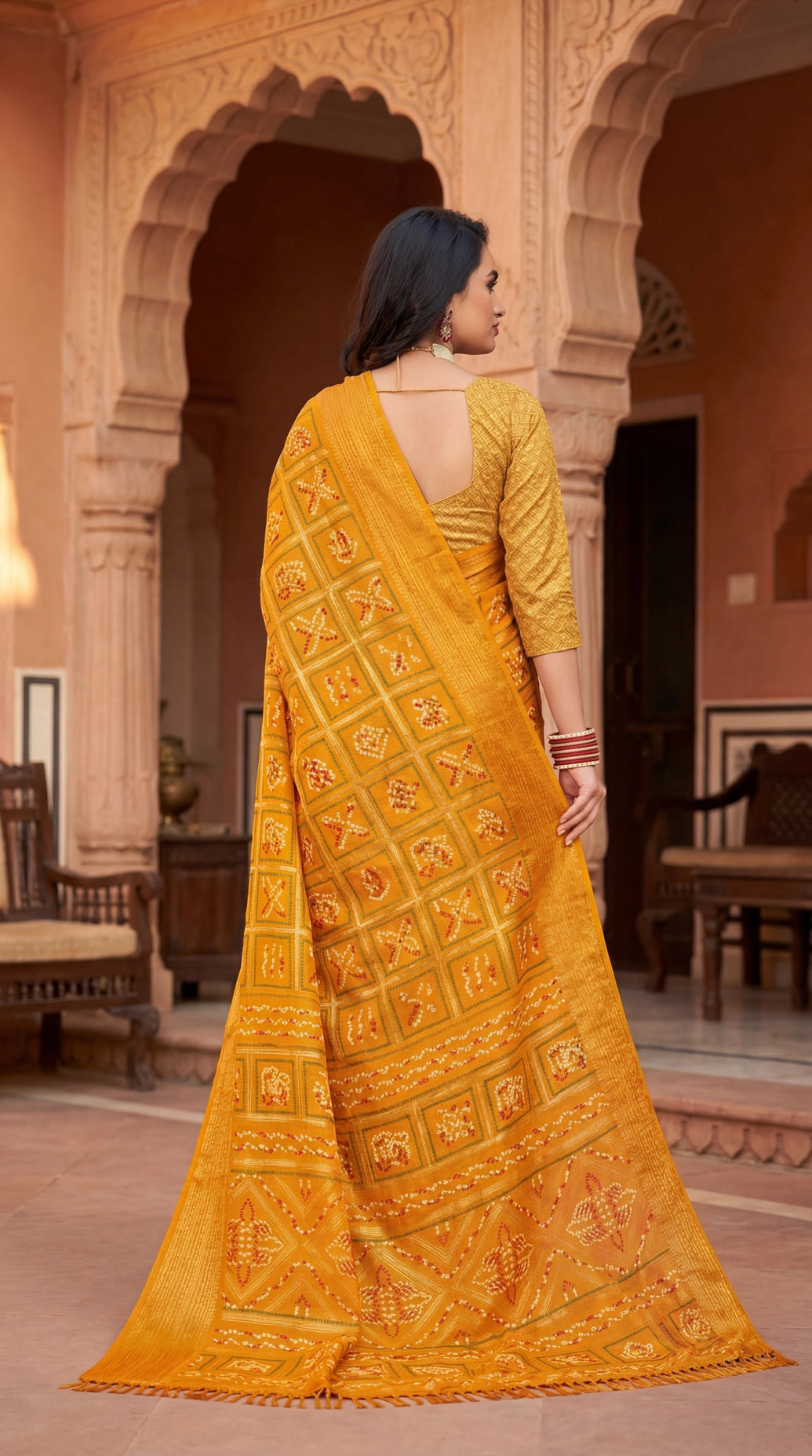 Yellow Bandhani Print Chiffon Saree with Gold Zari Motifs and Broad Border for Festive Wear