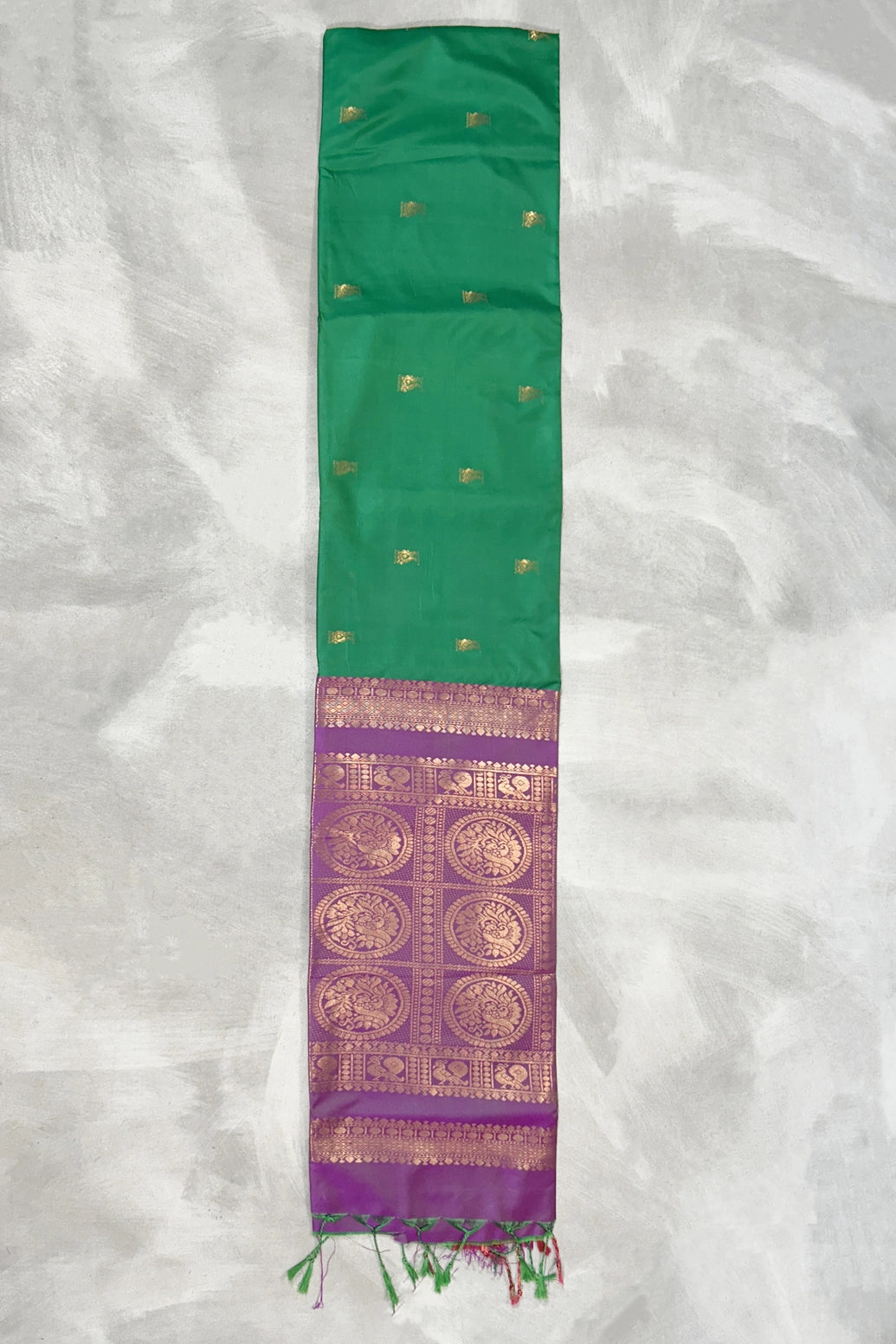 Green Semi Soft Silk Saree with Purple Contrast Border, Gold Zari Buttas & Traditional Floral Border
