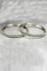 Silver-tone crystal bangles with sleek sparkle, perfect for festive wear, parties, and elegant ethnic styling.