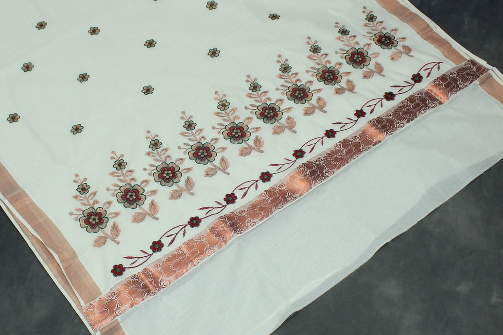 Fabric: Pure Kerala Cotton – lightweight, breathable, 
        •        Design: Rich machine embroidery in Copper zari and thread with detai