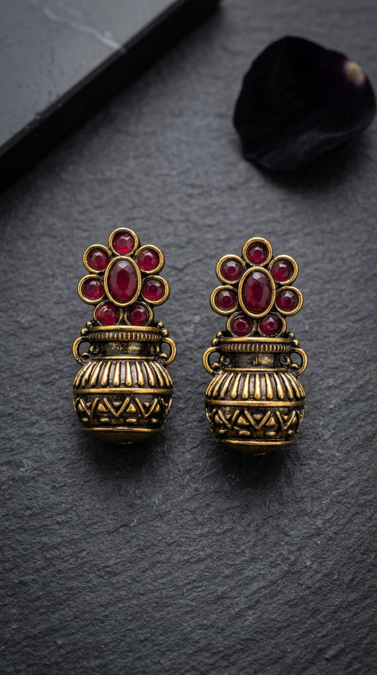 Red Antique Gold-Tone Jhumka Earrings with Floral Stud Design and Red Crystal Stones