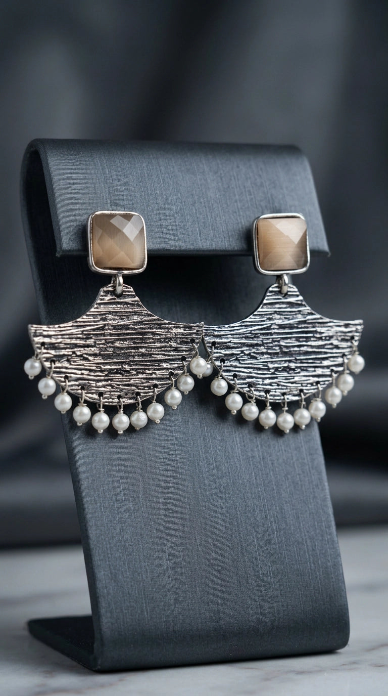 Cream Stone Silver-Tone Textured Teardrop Dangle Earrings with Pearl Drops for Festive Party Wear